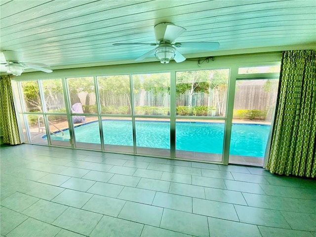 view of swimming pool featuring ceiling fan