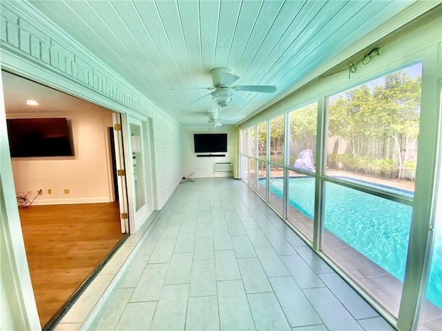 interior space with wood ceiling and tile patterned flooring