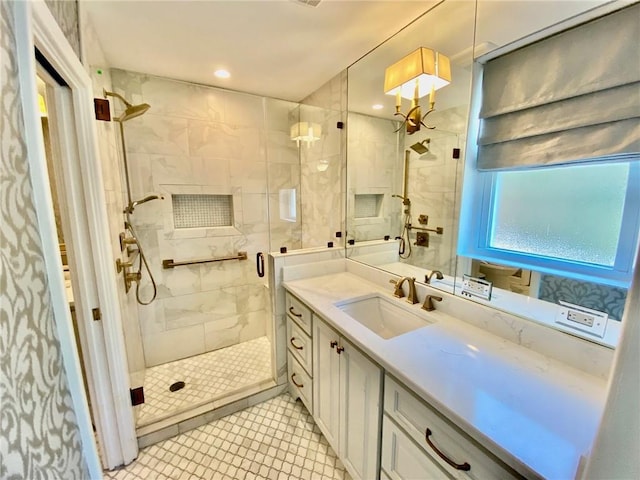 full bathroom featuring vanity, a shower stall, and recessed lighting