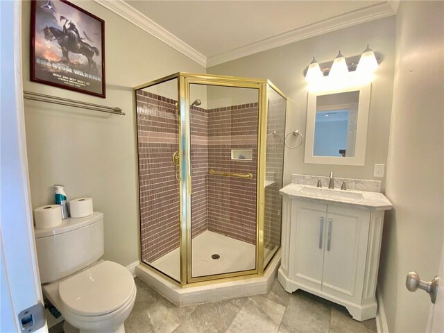 bathroom with a shower stall, vanity, toilet, and crown molding