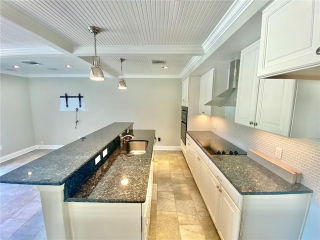 kitchen featuring beam ceiling, a sink, decorative backsplash, black appliances, and wall chimney range hood