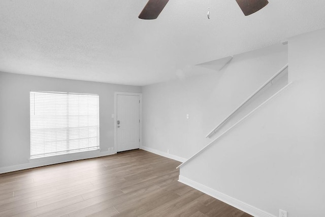 foyer with light wood-type flooring and ceiling fan