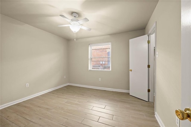 empty room featuring ceiling fan and light hardwood / wood-style floors