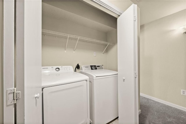 laundry area with carpet floors and washing machine and dryer