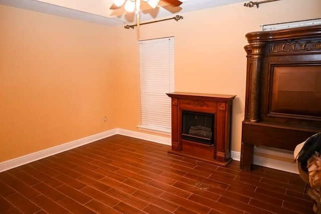 interior space featuring ceiling fan and dark wood-type flooring