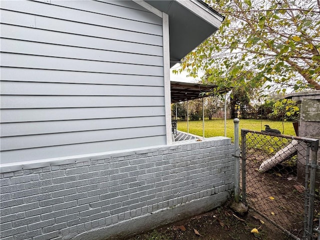 view of property exterior with a lawn