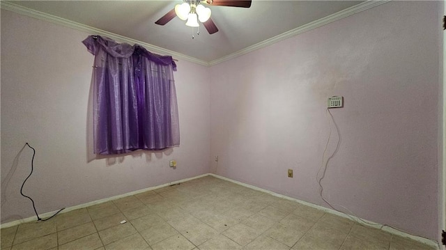 spare room featuring ceiling fan and ornamental molding