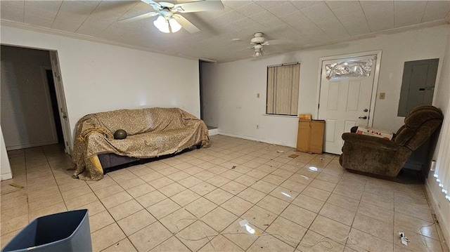 living room featuring electric panel, ceiling fan, light tile patterned floors, and ornamental molding