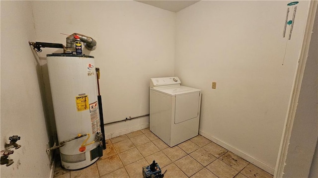 washroom with light tile patterned flooring, washer / dryer, and water heater