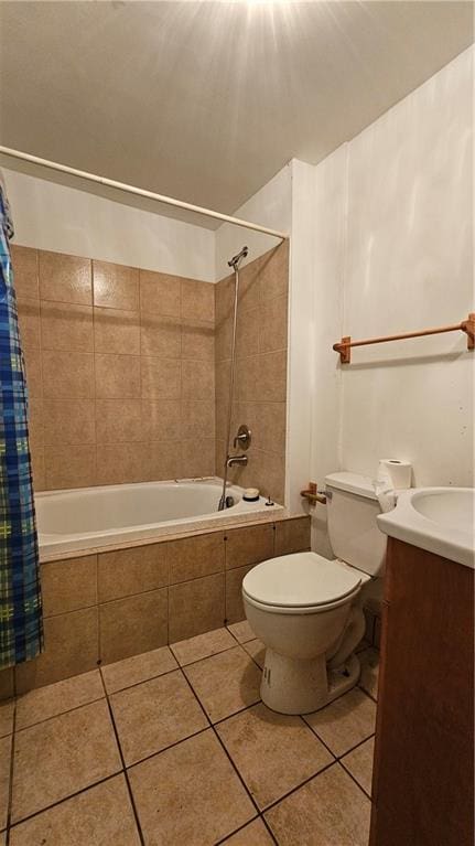 full bathroom featuring tile patterned floors, vanity, toilet, and shower / bathtub combination with curtain