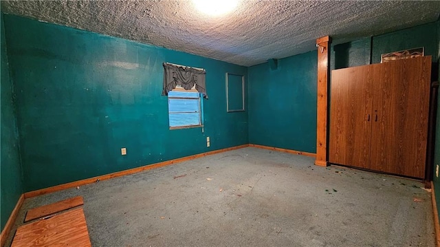 empty room with a textured ceiling