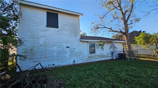 view of property exterior with a lawn