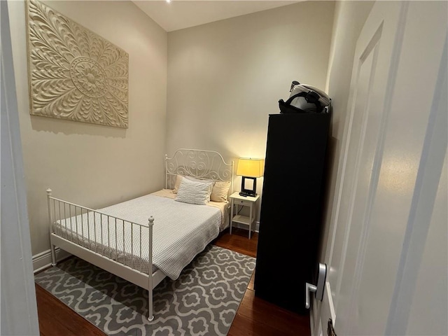 bedroom featuring dark hardwood / wood-style flooring