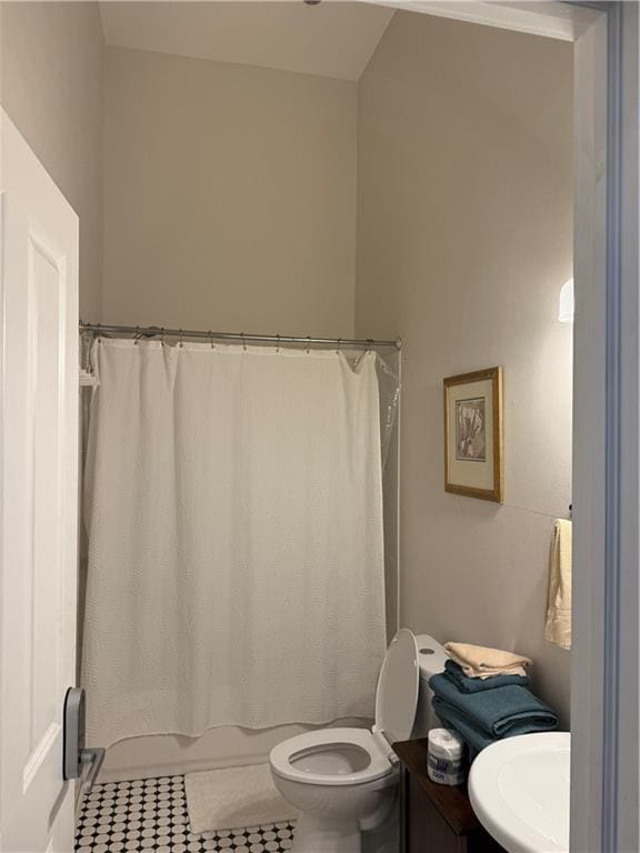 bathroom featuring tile patterned floors, toilet, and sink