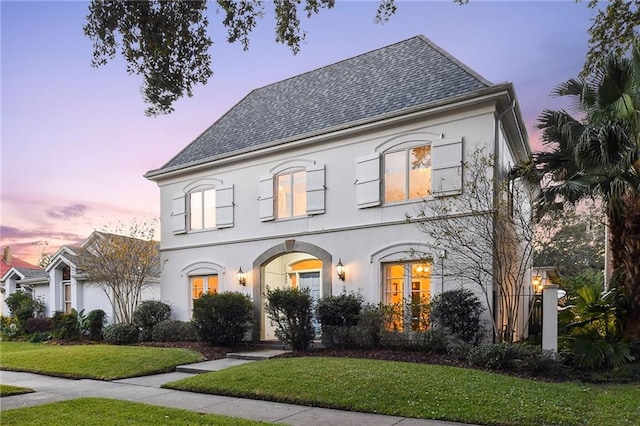 view of front of home with a yard