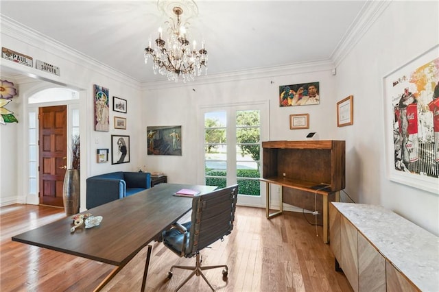 office area with light hardwood / wood-style flooring, a chandelier, and ornamental molding