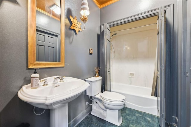 bathroom featuring tile patterned flooring, shower / tub combo, and toilet