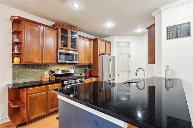 17198 Bridle Path, Hammond, LA 70403 - kitchen featuring crown molding, open shelves, appliances with stainless steel finishes, a sink, and tasteful backsplash