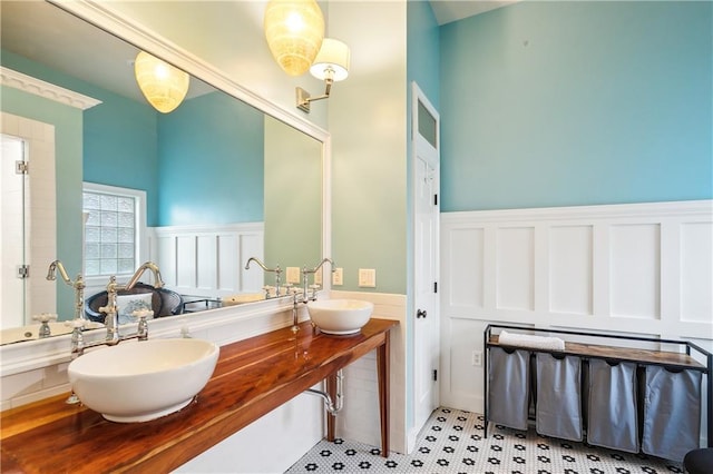 17198 Bridle Path, Hammond, LA 70403 - full bathroom featuring double vanity, a sink, and a wainscoted wall