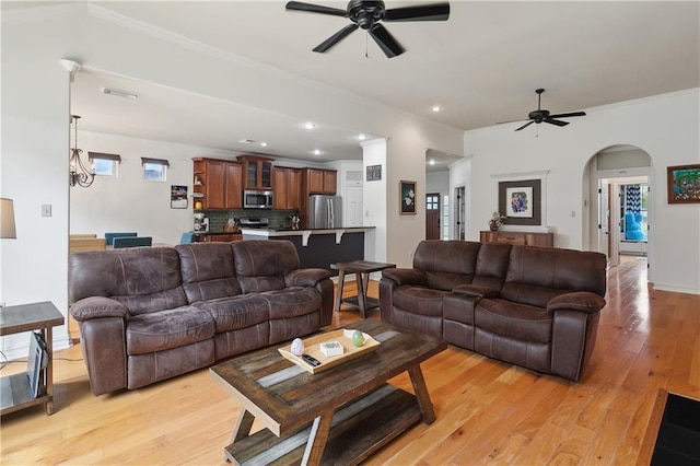 17198 Bridle Path, Hammond, LA 70403 - living room with crown molding, a ceiling fan, light wood-style flooring, and visible vents
