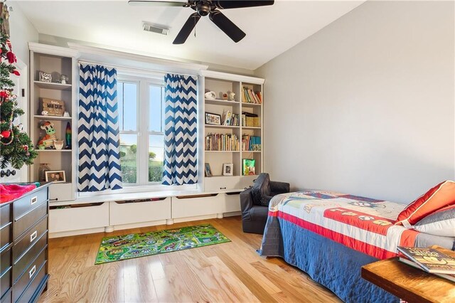 bedroom with ceiling fan and light wood-type flooring