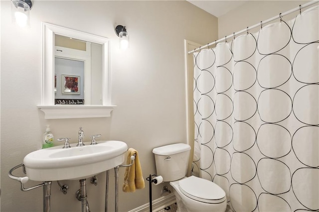 17198 Bridle Path, Hammond, LA 70403 - bathroom with a shower with curtain, baseboards, and toilet