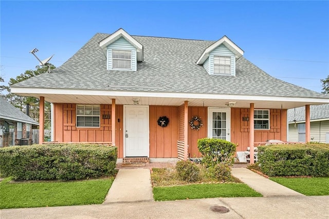 cape cod-style house with a porch