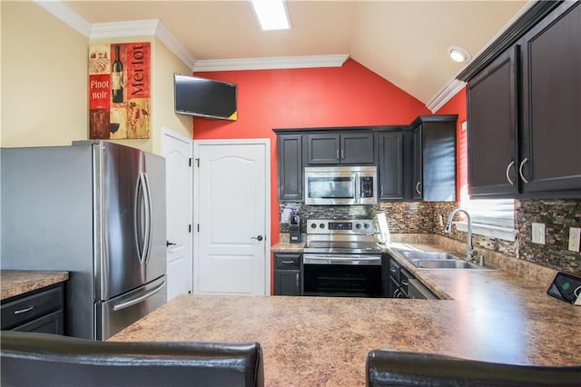 kitchen featuring crown molding, sink, vaulted ceiling, appliances with stainless steel finishes, and tasteful backsplash