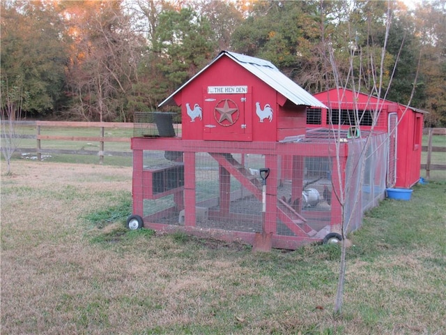 view of outbuilding featuring a lawn