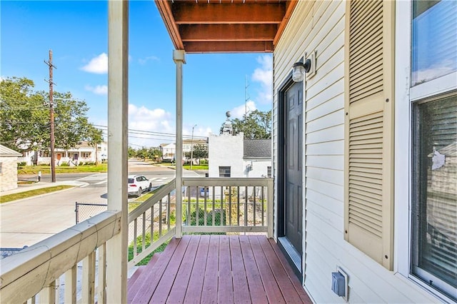 wooden terrace featuring a porch