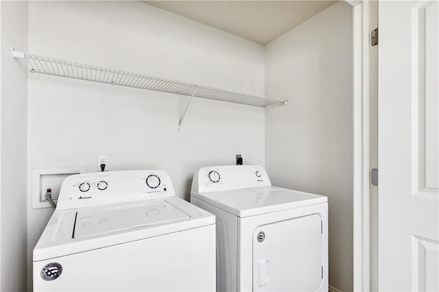 laundry area with washing machine and dryer