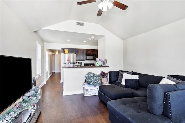 living room featuring ceiling fan, dark wood-type flooring, and lofted ceiling