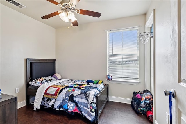 bedroom featuring ceiling fan and dark wood-type flooring