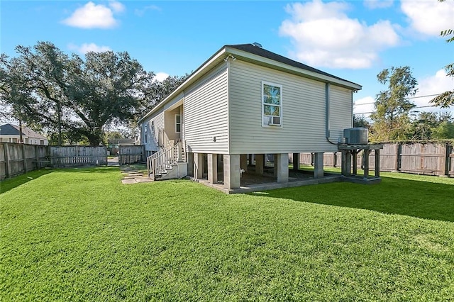 rear view of house with a lawn