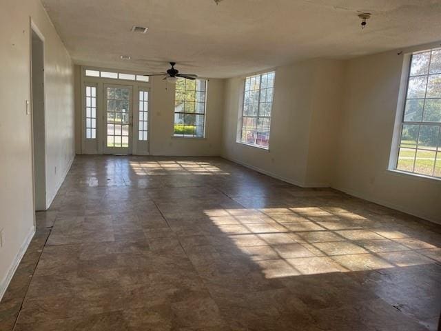 unfurnished room featuring ceiling fan