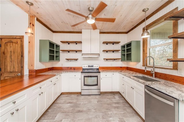 kitchen with pendant lighting, white cabinets, sink, and appliances with stainless steel finishes