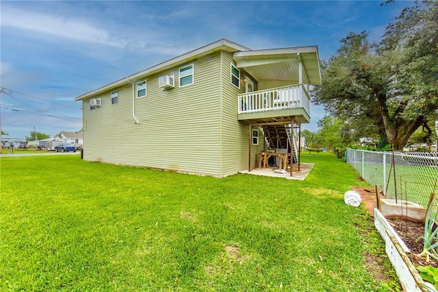 rear view of property with a yard and a patio