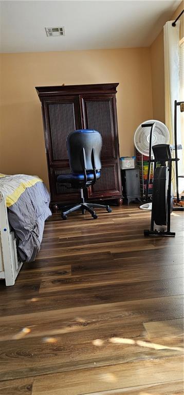 interior space with a notable chandelier and dark wood-type flooring