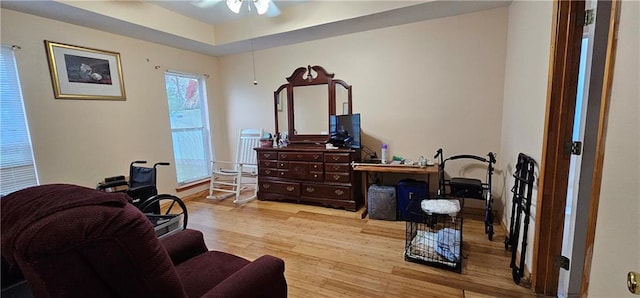 sitting room featuring ceiling fan and light hardwood / wood-style floors