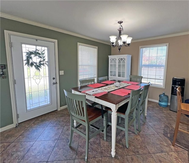 tiled dining area with ornamental molding and a notable chandelier