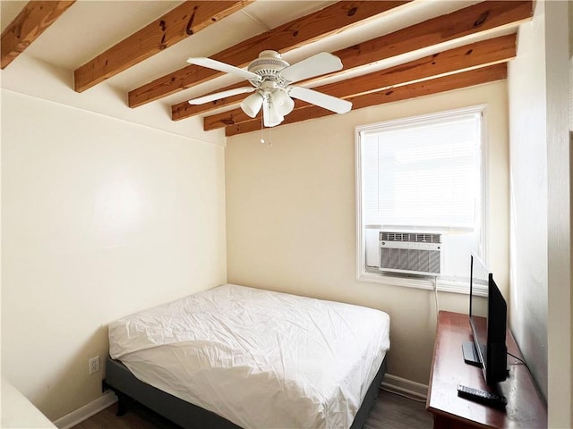 bedroom featuring ceiling fan, beam ceiling, and cooling unit