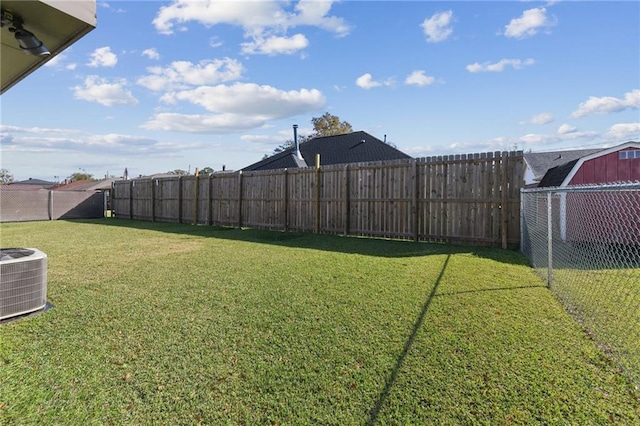 view of yard with central AC