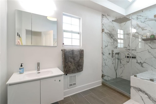 bathroom with vanity, vaulted ceiling, and walk in shower