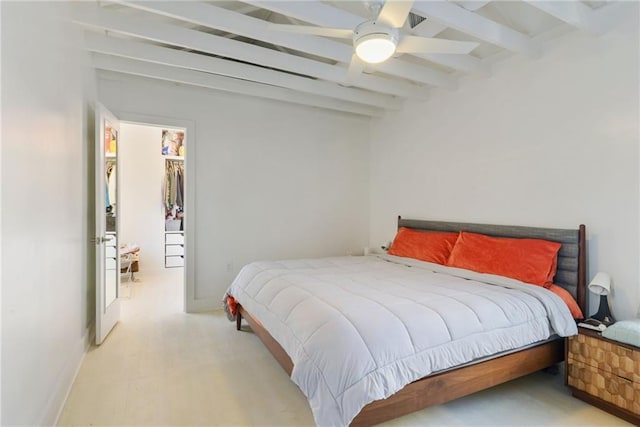 bedroom featuring ceiling fan, a spacious closet, light hardwood / wood-style flooring, beamed ceiling, and a closet