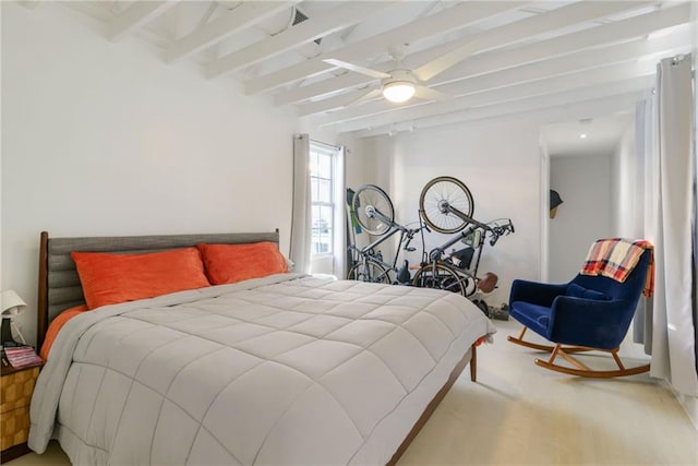 bedroom with beamed ceiling, ceiling fan, and carpet