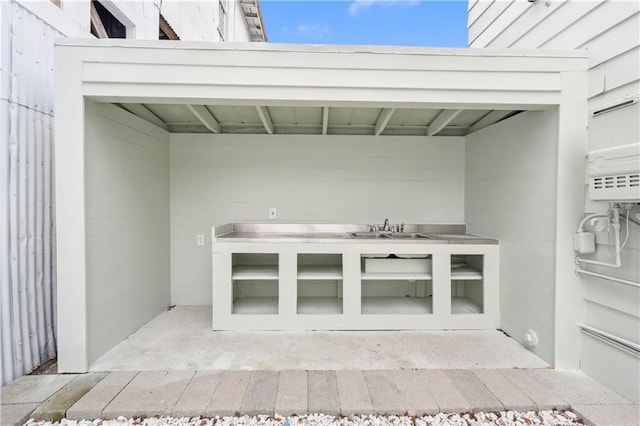 exterior space featuring concrete floors and sink