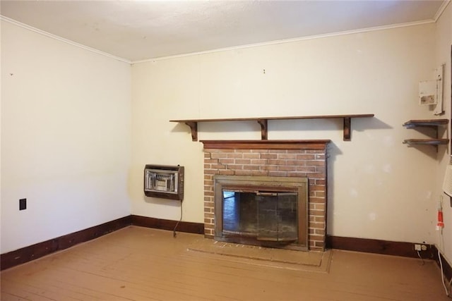 unfurnished living room with heating unit, crown molding, and a brick fireplace