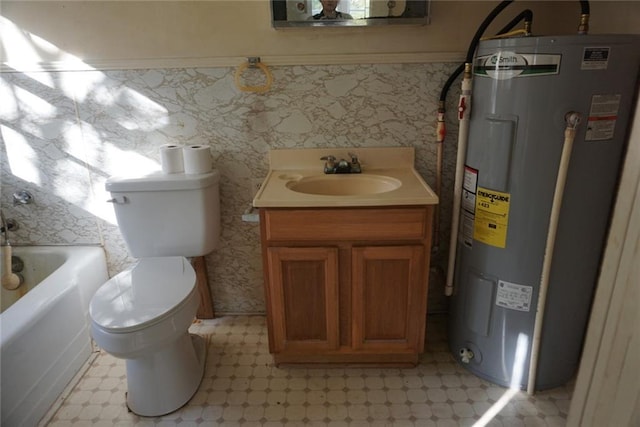 bathroom featuring a tub, electric water heater, vanity, and toilet