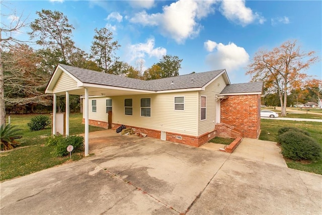 view of property exterior featuring a carport and a yard