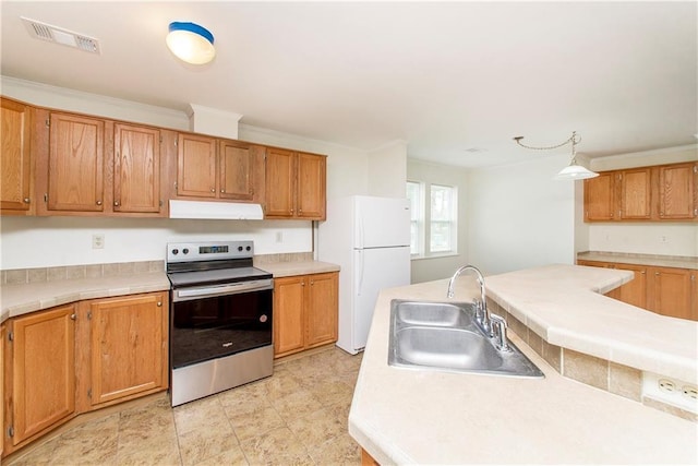 kitchen featuring pendant lighting, stainless steel range with electric cooktop, crown molding, sink, and white fridge